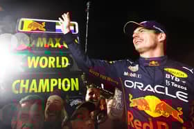 SUZUKA, JAPAN - OCTOBER 09: Race winner and 2022 F1 World Drivers Champion Max Verstappen of Netherlands and Oracle Red Bull Racing celebrates with his team after the F1 Grand Prix of Japan at Suzuka International Racing Course on October 09, 2022 in Suzuka, Japan. (Photo by Mark Thompson/Getty Images )