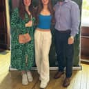 Izzy with her parents on results day.