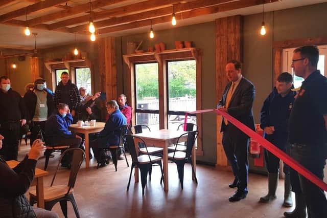 Greg Smith MP opens the Potting Shed Cafe with general manager Matt Philcox and adult care clients Matthew and Glen