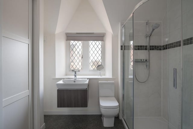 The family shower room complements a Jacuzzi bathroom, which is adjacent to the main bedroom
