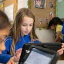 Young pupils are Holmwood School in Milton Keynes enjoying their new iPads