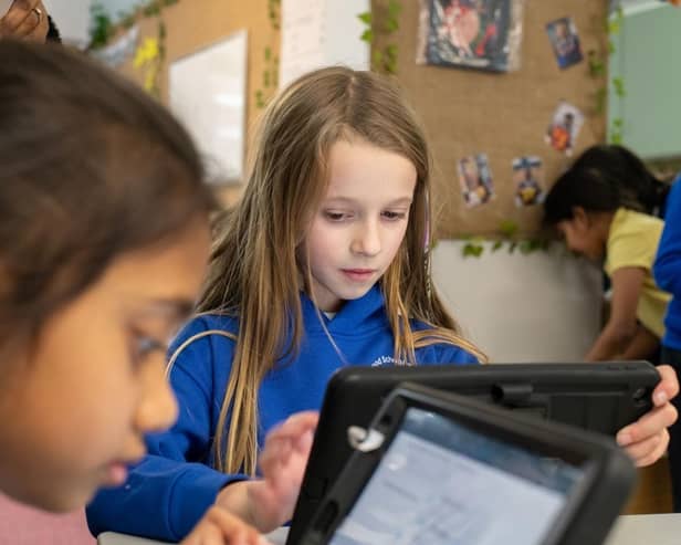Young pupils are Holmwood School in Milton Keynes enjoying their new iPads