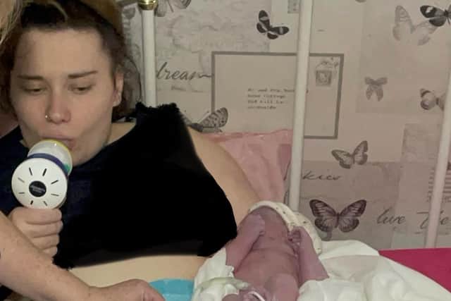 Codee pictured minutes after the surprise birth, by which time paramedic had arrived at her Milton Keynes home