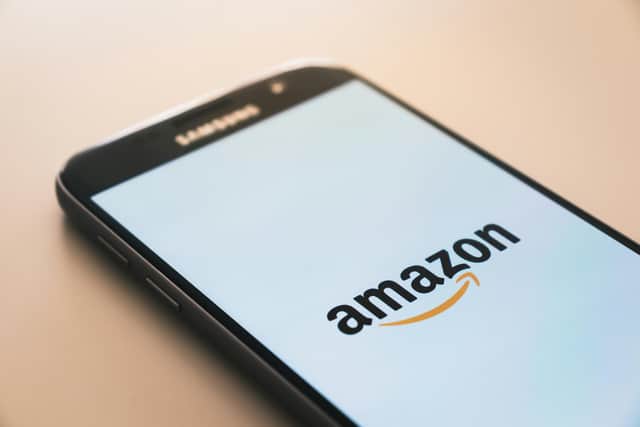 Smart phone showing Amazon logo.