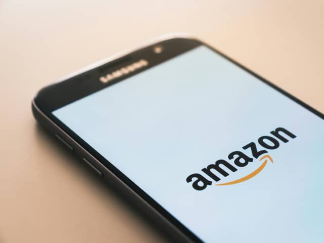 Smart phone showing Amazon logo.