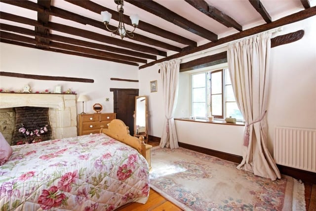 One of the six bedrooms is spacious with feature ceiling beams