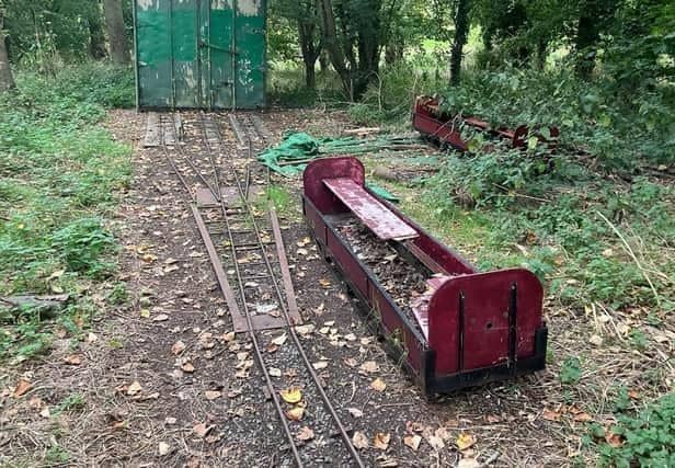 A rotting carriage is one of the few parts visible of the once-iconic miniature railway at Willen Lake in Milton Keynes