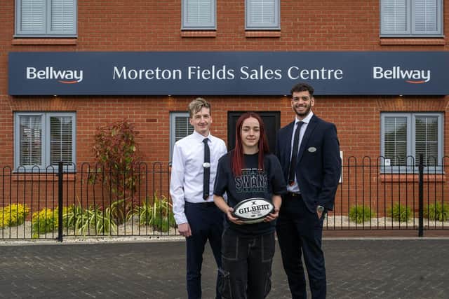 Robert Hettzman, Sales Advisor at Bellway Moreton Fields; Bella Pettit, Buckingham Swans rugby player sponsored by Bellway; and Luke Moore, Sales Advisor at Bellway Moreton Fields, are pictured outside the new sales centre at the Moreton Fields development.