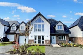 The house sits in a gated community with countryside views