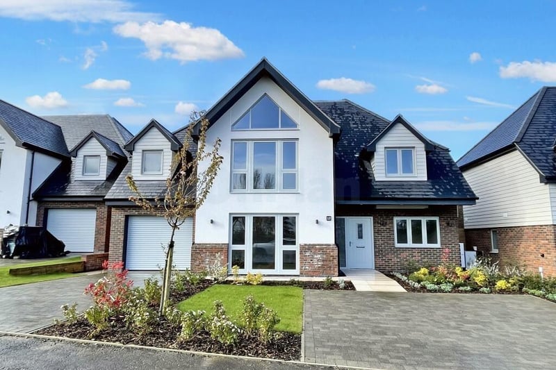 The house sits in a gated community with countryside views