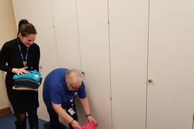 PJ Care workers Charley Neal and Judith Thomas pack the coloured shirts to send to Africa