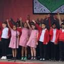 Children from Jubilee Wood primary school sing their special song about how good it is to live on Fishermead in Milton Keynes