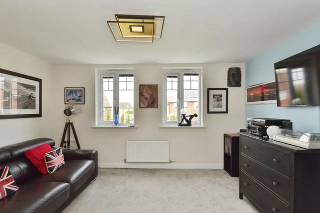 The first floor features what is described as a large living room