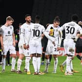 MK Dons getting some instructions pitchside during the 0-0 draw with Lincoln City