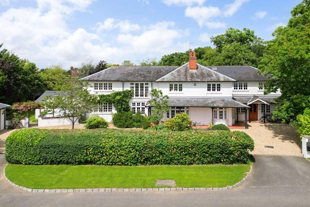 This beautiful detached family home sits on a third acre plot, including three sides of landscaped gardens.