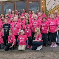 Distinctive pink T-shirts used as volunteer uniform at Milton Keynes festival set to be auctioned in aid of charity