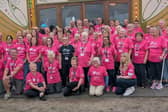 Distinctive pink T-shirts worn by volunteers at the IF: Milton Keynes International Festival are being signed by musicians and celebrities and auctioned in aid of the Breast Cancer Now charity