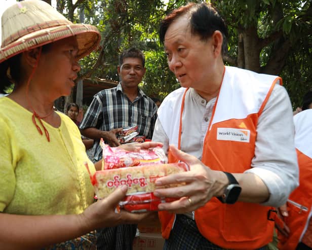 World Vision Myanmar National Director Dr Kyi Minn helped distribute essential food items to the earthquake-affected people.