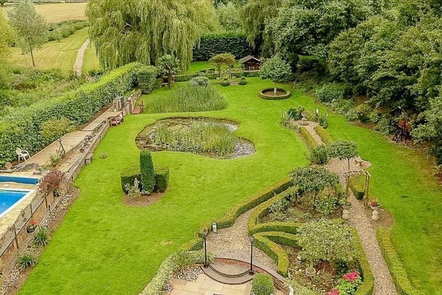 An aerial view of the grounds of this stunning property which benefits from many luxury features including a swimming pool