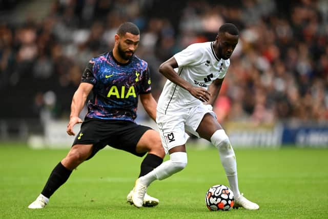 Mo Eisa of Milton Keynes Dons is challenged by Cameron Carter-Vickers of Tottenham Hotspur during the Pre-Season Friendly match between Milton Keynes Dons and Tottenham Hotspur (Photo by Shaun Botterill/Getty Images)