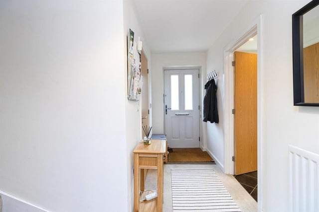 The hallway features a double glazed front door with cloakroom, lounge/diner and kitchen leading off