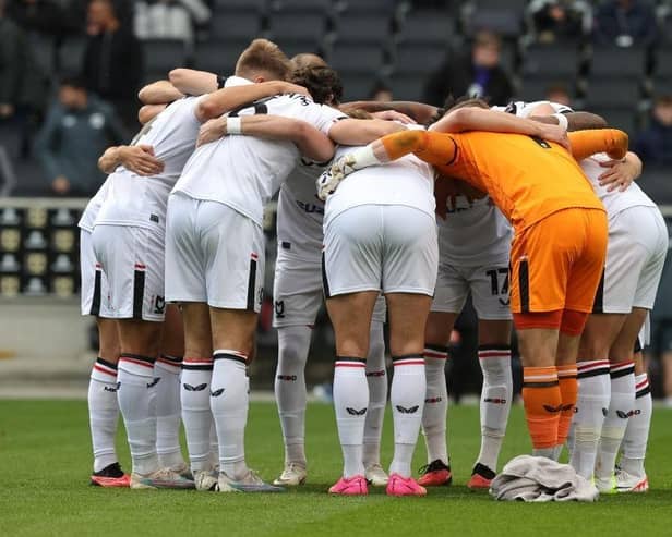 Milton Keynes Dons are being given less than 30 per cent chance of making the play-offs this season.