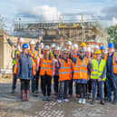 Group celebrating the completion of structural work at Camphill MK
