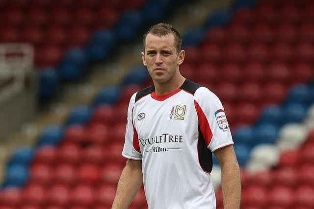 Aaron Wilbraham left Dons for Norwich City in December 2010, winning promotion to the Premier League with the Canaries. He moved to Crystal Palace before settling with Bristol City. On 2 December 2020, Wilbraham joined Steve Cotterill's coaching staff at League One side Shrewsbury Town, joining as assistant manager.
