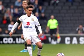 MK Dons are a point off the play-offs after a surge up the table.