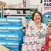 Cllr Jane Catt pictured with some of the thousands of free feminine hygiene products to be distributed around Milton Keynes