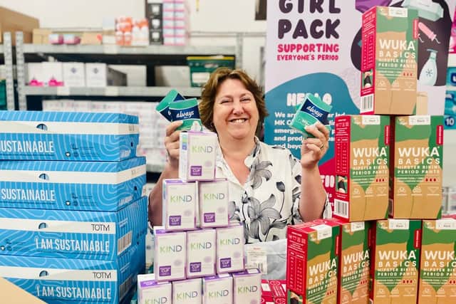 Cllr Jane Catt pictured with some of the thousands of free feminine hygiene products to be distributed around Milton Keynes