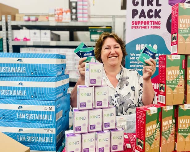 Cllr Jane Catt pictured with some of the thousands of free feminine hygiene products to be distributed around Milton Keynes