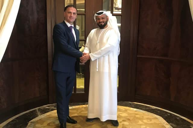 ‘WorkBuzz’s Lee West (left) shakes hands with Dr. Ali Ahmed Al Hosani, CEO of Azure Media Group (right)’
