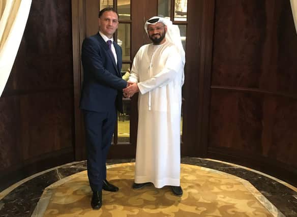 ‘WorkBuzz’s Lee West (left) shakes hands with Dr. Ali Ahmed Al Hosani, CEO of Azure Media Group (right)’