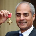 George Alagiah at Buckingham Palace after collecting his OBE from the Queen.