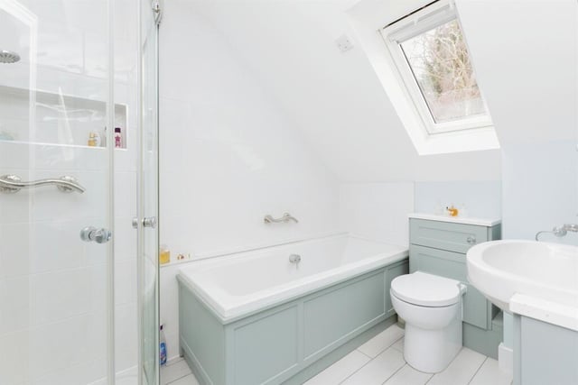 One of the en-suite bathrooms features a four-piece suite comprising wooden panel bath and single glass shower cubicle, enclosed cistern WC and vanity unit wash hand basin with Quartz surface.
