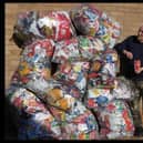 Recycling king George with his mountain of crisp packets