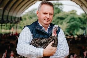 Ed Hurford holding one of the turkeys
