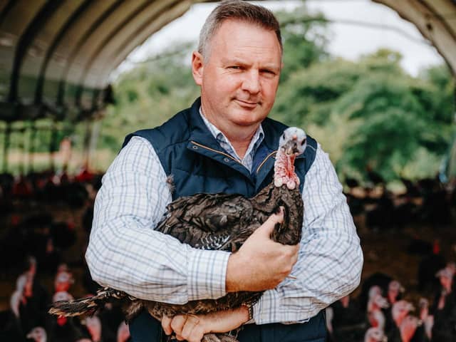 Ed Hurford holding one of the turkeys