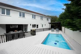The property is finished to a high specification with private garden and heated swimming pool.