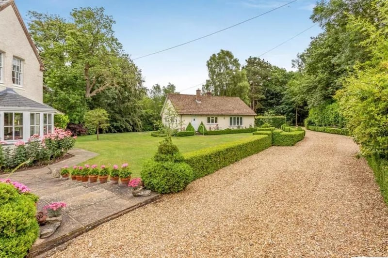 The driveway provides plenty of parking space for residents and guests