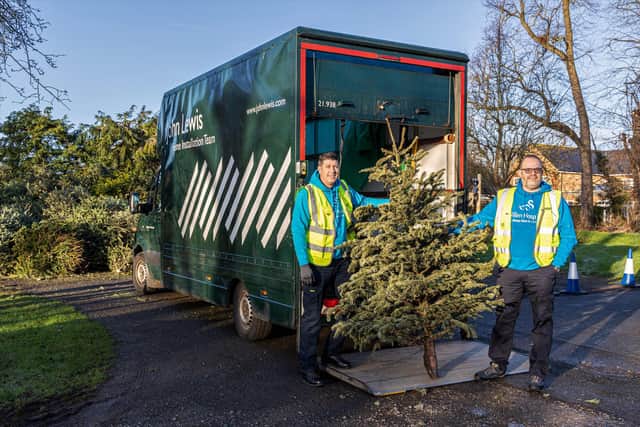 Willen Hospice volunteers take the Christmas trees away for chipping