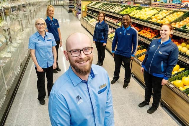 New store manager Nick Taylor pictured with staff at the opening of a new Aldi store at Kingston