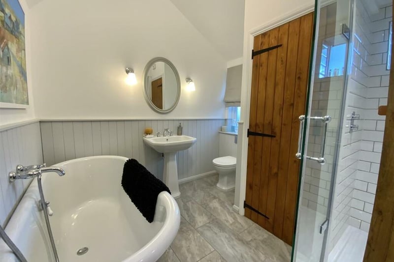 The family bathroom has a four piece suite comprising wc, wash basin, roll top bath with ball and claw feet, wall mounted mixer tap and a separate double sized shower cubicle. Tiling and timber panelling to walls, window to the rear and an airing cupboard housing the gas central heating boiler.