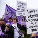 Protestors from the WASPI (Women Against State Pension Inequality) group demonstrate outside the Houses of Parliament