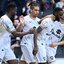 MK Dons celebrate Mo Eisa's goal in the 1-1 draw with Portsmouth on Good Friday at Stadium MK