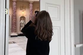 Photographer taking a shot of the Marble Saloon at Stowe House