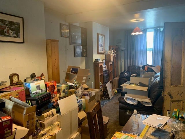 The living room is somewhat cluttered