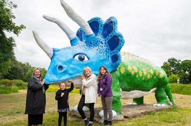 Competition winner Freya is pictured with the judges and artists at MK's famous Triceratops