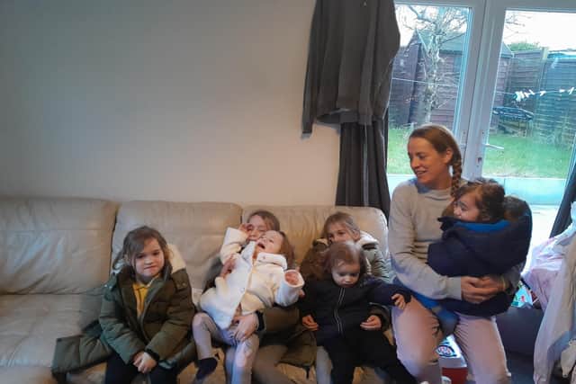 Polly with six of her seven children in their freezing cold Milton Keynes home